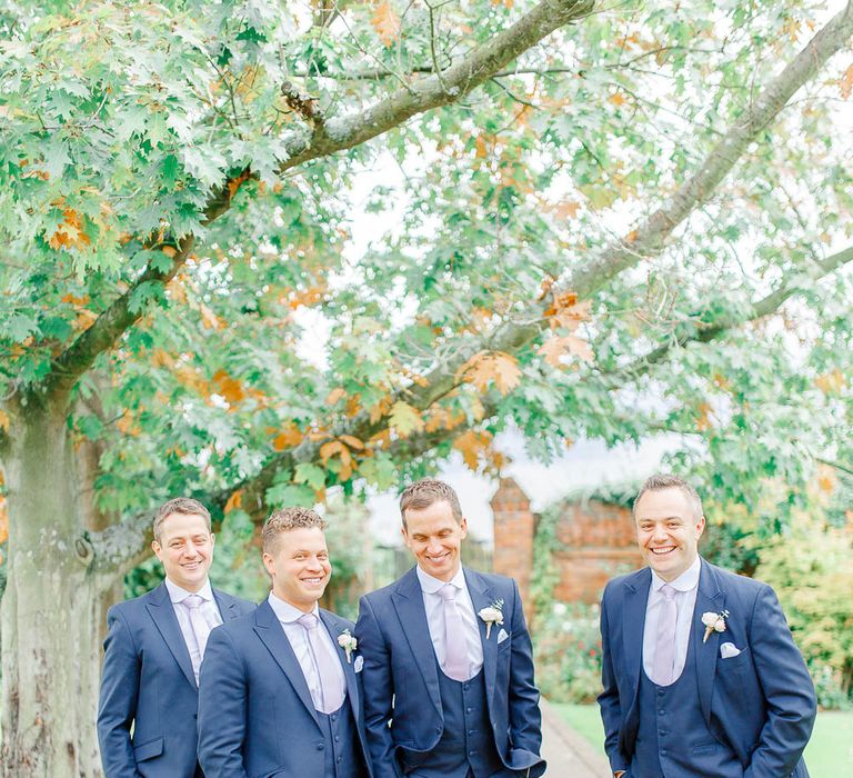 Groomsmen in Navy Three-piece Suits | Elegant Pastel Wedding at Gaynes Park, Essex | White Stag Wedding Photography | At Motion Film