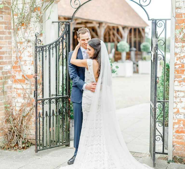 Bride in Lace Gown from Blackburn Bridal | Groom in Navy Three-piece Suit | Elegant Pastel Wedding at Gaynes Park, Essex | White Stag Wedding Photography | At Motion Film