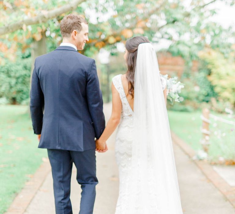 Bride in Lace Gown from Blackburn Bridal | Groom in Navy Three-piece Suit | Elegant Pastel Wedding at Gaynes Park, Essex | White Stag Wedding Photography | At Motion Film