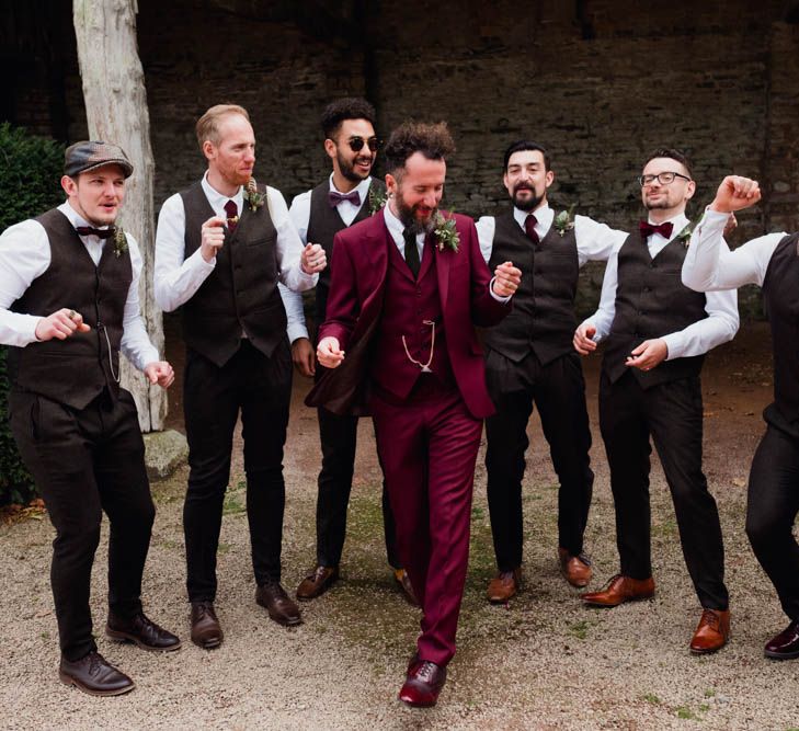 Groom in Burgundy Suit | Groomsmen in Bow Ties & Waistcoats | Outdoor Wedding at Dewsall Court Oxfordshire | Claudia Rose Carter Photography | Costa Sister Productions