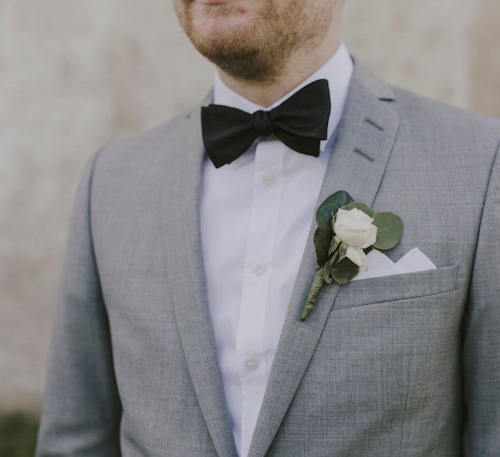 Groom in Grey Tiger of Sweden Suit