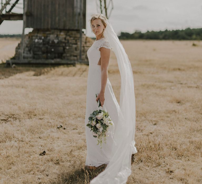 Bride in By Malina Bridal Gown