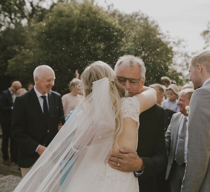 Bride Hugging Wedding Guests