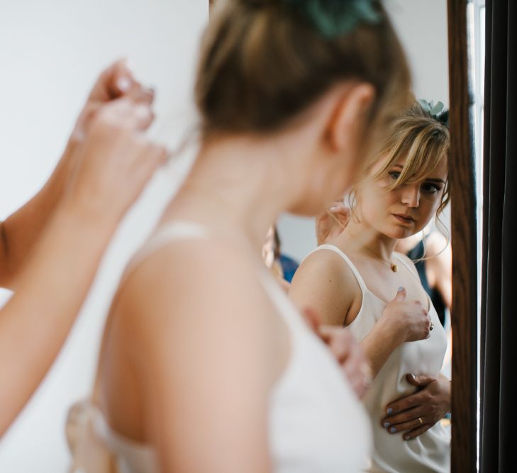 Delphine Manivet Bride With Bridesmaids In Reformation & Stylish London Wedding At Town Hall Hotel With Groom In Light Green & Images By Chris Barber