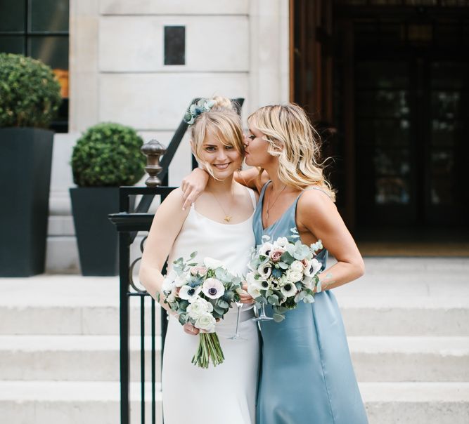 Delphine Manivet Bride With Bridesmaids In Reformation & Stylish London Wedding At Town Hall Hotel With Groom In Light Green & Images By Chris Barber