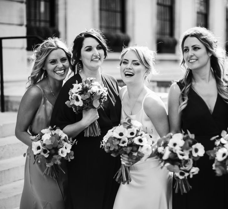 Delphine Manivet Bride With Bridesmaids In Reformation & Stylish London Wedding At Town Hall Hotel With Groom In Light Green & Images By Chris Barber