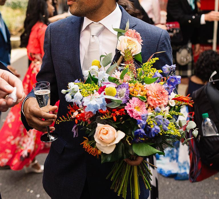 Groom in Banana Republic Suit & Bright Bridal Bouquet