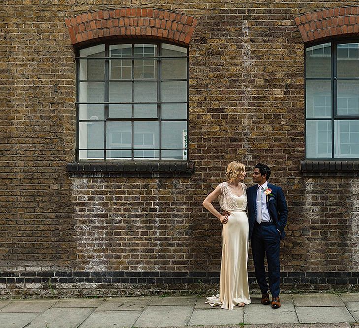 Glamorous Bride in Catherine Deane Zaden Wedding Dress & Groom in Banana Republic Suit