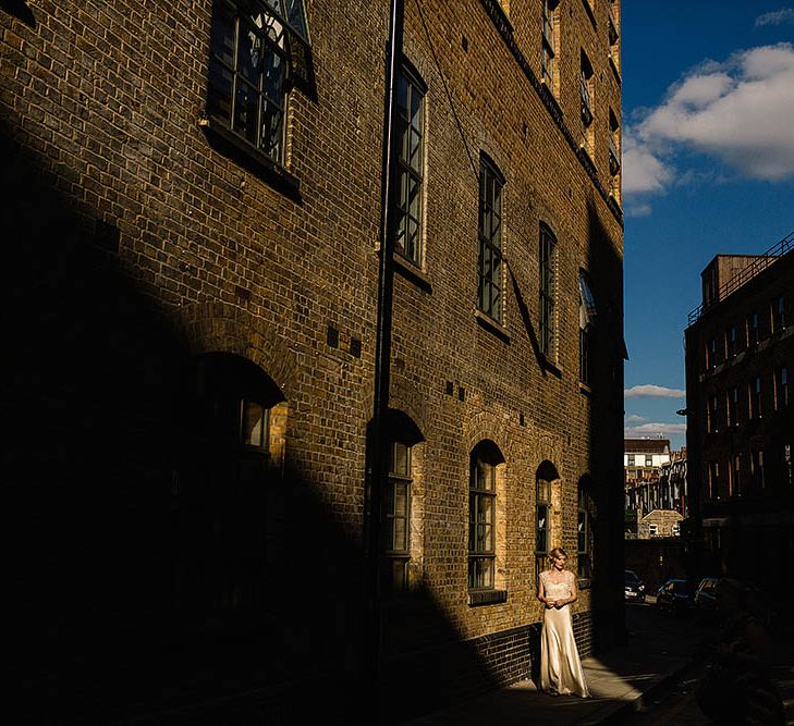 Glamorous Bride in Catherine Deane Zaden Wedding Dress & Groom in Banana Republic Suit