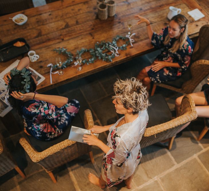 Bridesmaids In Floral Robes On Morning Of Wedding