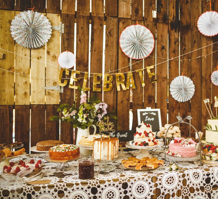 Wooden Trestle Tables With Bud Vases And White Drapes // Daisy By Halfpenny London For A Boho Barn Wedding In Yorkshire With Decor By Wild At Heart Weddings Images By Photography 34