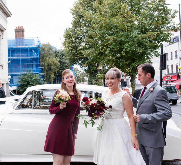 Bride in Bespoke Tea Length Dress | Bridesmaid in Burgundy Dress | 60s Inspired London Pub Wedding | The Peasant | Babb Photo