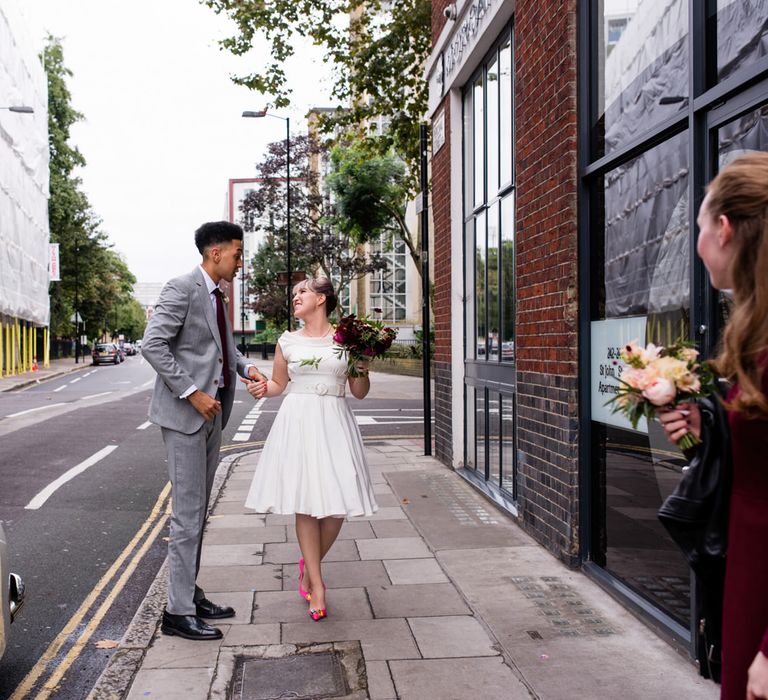 Bride in Bespoke Tea Length Wedding Dress | Groom in Grey Jaeger Suit | 60s Inspired London Pub Wedding | The Peasant | Babb Photo