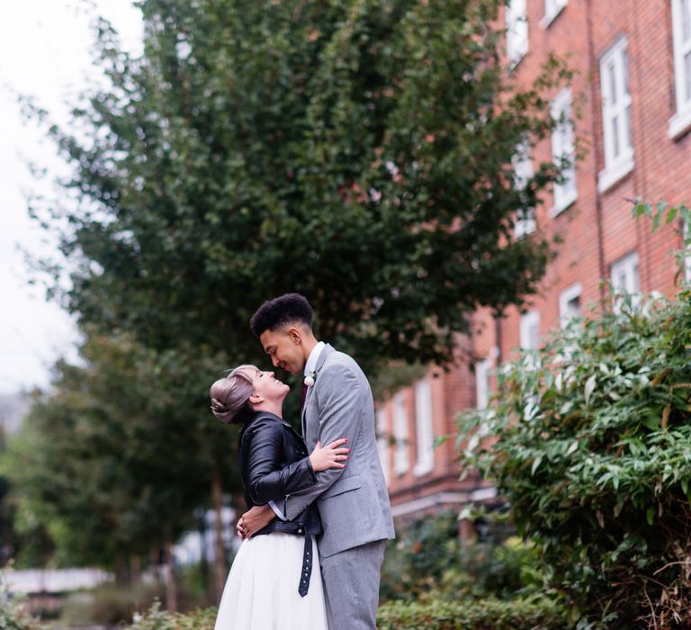 Bride in Bespoke Tea Length Wedding Dress | Groom in Grey Jaeger Suit | 60s Inspired London Pub Wedding | The Peasant | Babb Photo