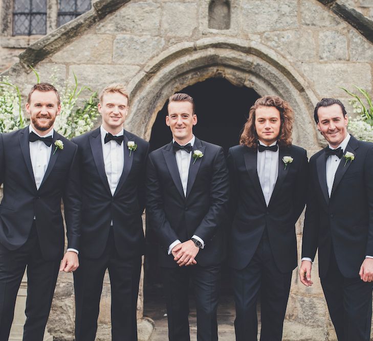 Groomsmen in Black Tie Wedding Suits