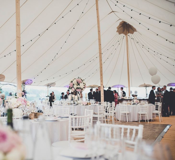 Inside PapaKåta Sperry Tent with Blush Flowers & Festoon Lights