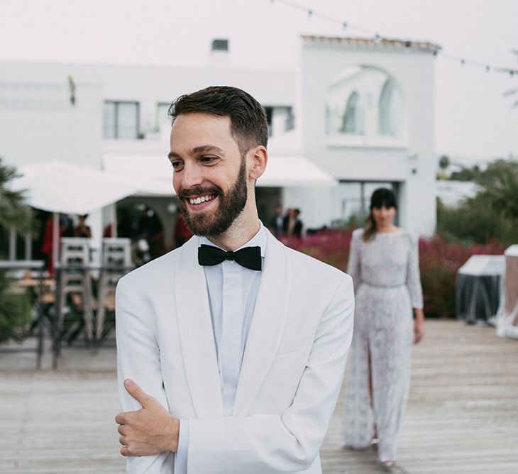 First Look | Groom in Tailor Made Tom Black Suit | Bride in Embellished Ze García Bridal Gown with Front Split | Stylish Outdoor Wedding at Masia Casa del Mar in Barcelona, Spain | Sara Lobla Photography | Made in Video Film