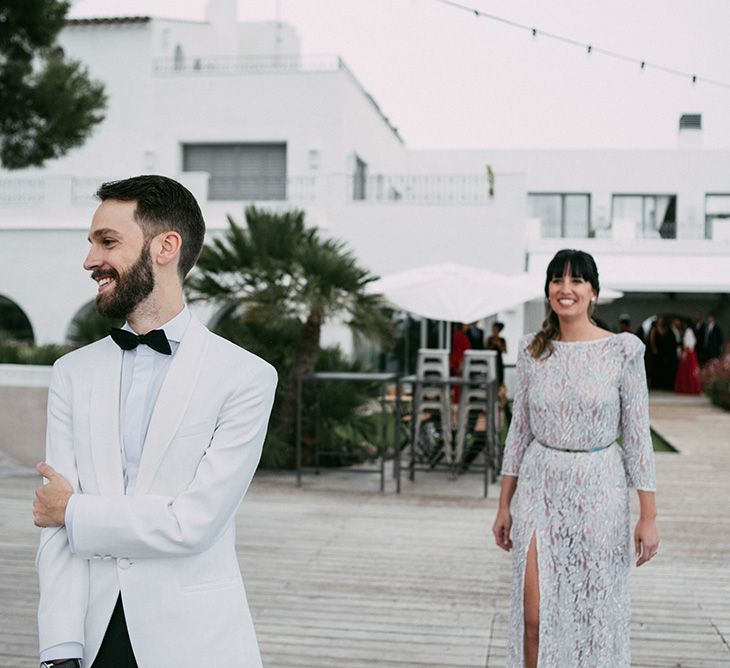 First Look | Groom in Tailor Made Tom Black Suit | Bride in Embellished Ze García Bridal Gown with Front Split | Stylish Outdoor Wedding at Masia Casa del Mar in Barcelona, Spain | Sara Lobla Photography | Made in Video Film