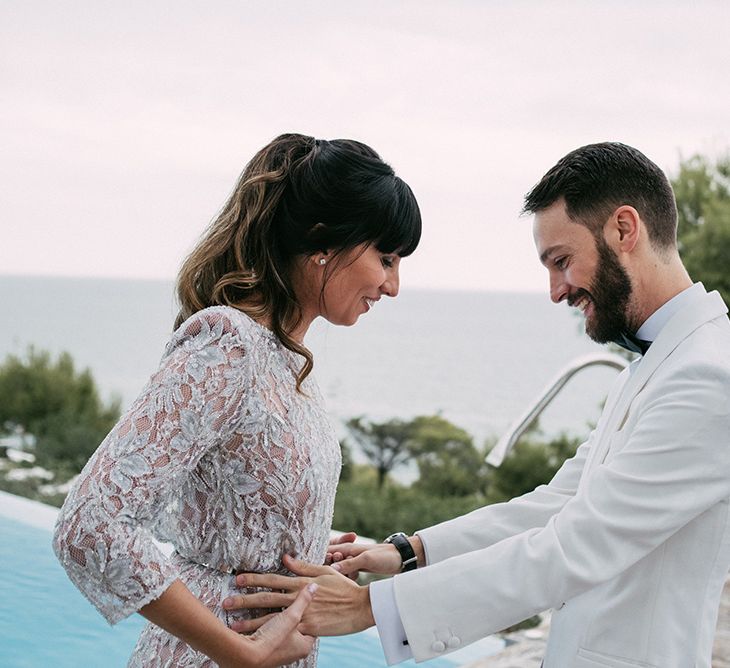 First Look | Groom in Tailor Made Tom Black Suit | Bride in Embellished Ze García Bridal Gown with Front Split | Stylish Outdoor Wedding at Masia Casa del Mar in Barcelona, Spain | Sara Lobla Photography | Made in Video Film