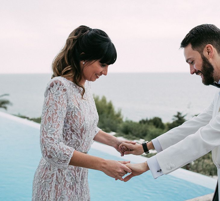 First Look | Groom in Tailor Made Tom Black Suit | Bride in Embellished Ze García Bridal Gown with Front Split | Stylish Outdoor Wedding at Masia Casa del Mar in Barcelona, Spain | Sara Lobla Photography | Made in Video Film