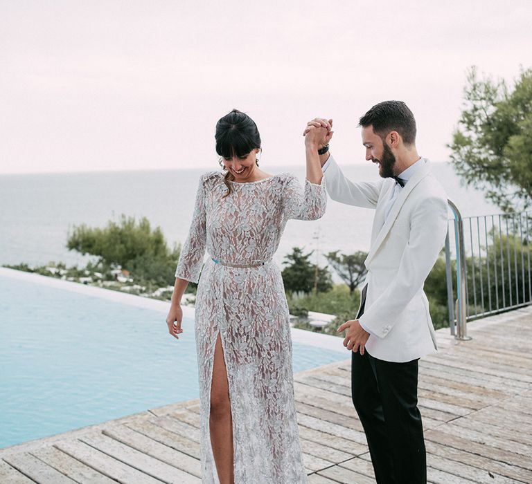 First Look | Groom in Tailor Made Tom Black Suit | Bride in Embellished Ze García Bridal Gown with Front Split | Stylish Outdoor Wedding at Masia Casa del Mar in Barcelona, Spain | Sara Lobla Photography | Made in Video Film