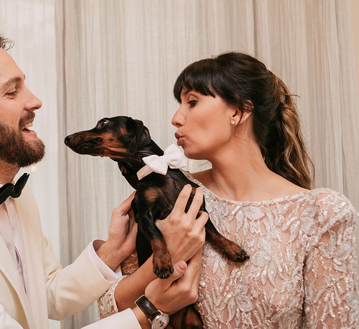 Pet Dachshund | Groom in Tailor Made Tom Black Suit | Bride in Embellished Ze García Bridal Gown with Front Split | Stylish Outdoor Wedding at Masia Casa del Mar in Barcelona, Spain | Sara Lobla Photography | Made in Video Film