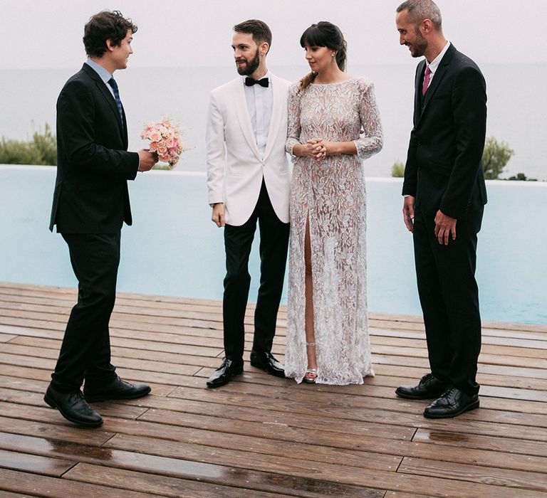 Bride in Embellished Ze García Bridal Gown with Front Split | Groom in Tailor Made Tom Black Suit | Stylish Outdoor Wedding at Masia Casa del Mar in Barcelona, Spain | Sara Lobla Photography | Made in Video Film