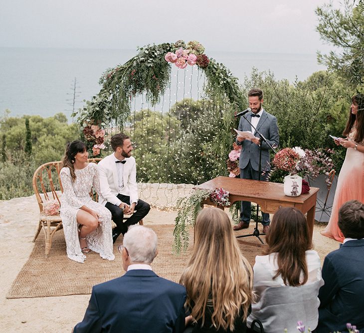 Wedding Ceremony | Bride in Embellished Ze García Bridal Gown with Front Split | Groom in Tailor Made Tom Black Suit | Stylish Outdoor Wedding at Masia Casa del Mar in Barcelona, Spain | Sara Lobla Photography | Made in Video Film