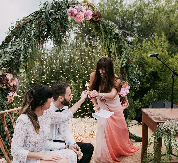 Wedding Ceremony | Bride in Embellished Ze García Bridal Gown with Front Split | Groom in Tailor Made Tom Black Suit | Stylish Outdoor Wedding at Masia Casa del Mar in Barcelona, Spain | Sara Lobla Photography | Made in Video Film