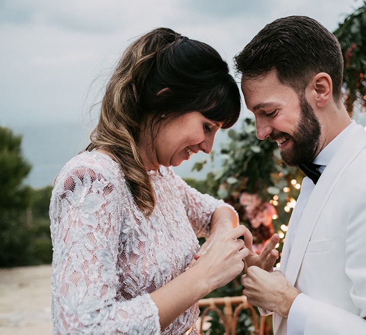 Exchanging of Rings | Bride in Embellished Ze García Bridal Gown with Front Split | Groom in Tailor Made Tom Black Suit | Stylish Outdoor Wedding at Masia Casa del Mar in Barcelona, Spain | Sara Lobla Photography | Made in Video Film