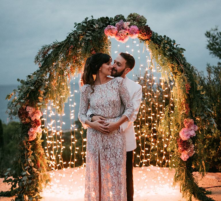 Bride in Embellished Ze García Bridal Gown with Front Split | Groom in Tailor Made Tom Black Suit | Stylish Outdoor Wedding at Masia Casa del Mar in Barcelona, Spain | Sara Lobla Photography | Made in Video Film