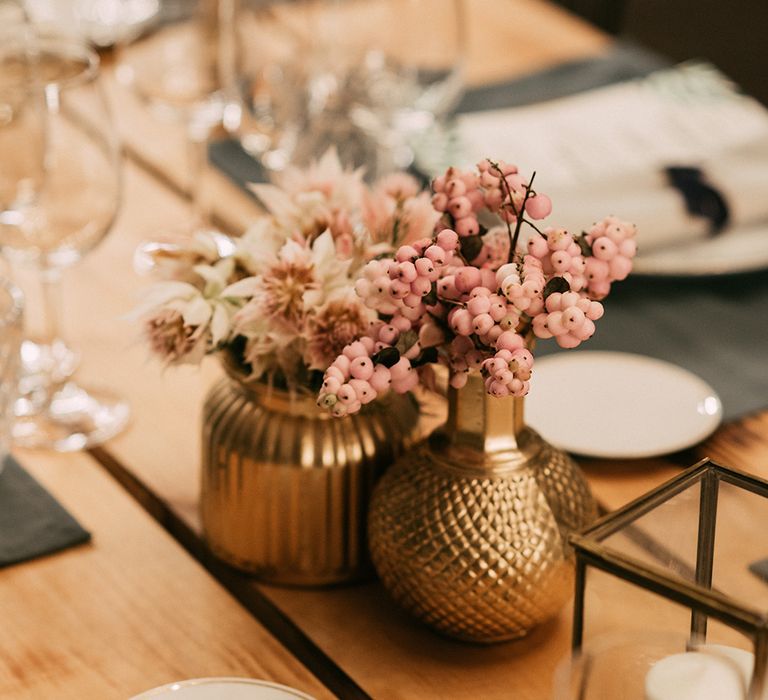 Gold Vases with Pink Berry Decor | Stylish Outdoor Wedding at Masia Casa del Mar in Barcelona, Spain | Sara Lobla Photography | Made in Video Film