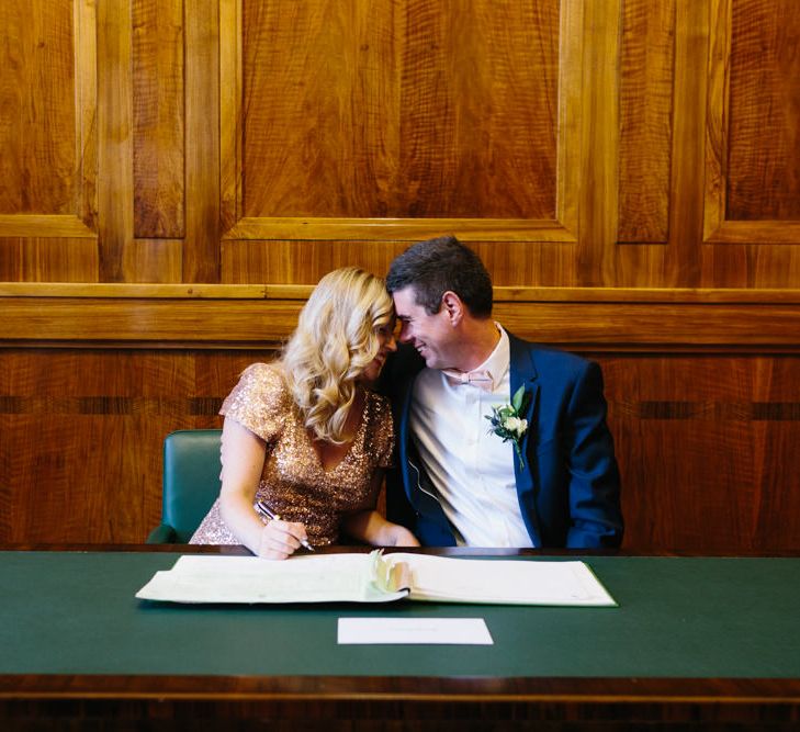 Bride & Groom Signing the Register