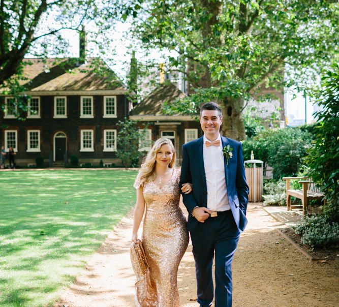 Bride in Gold Sequin Gibson Bespoke Wedding Dress & Groom in Marks and Spencer Suit