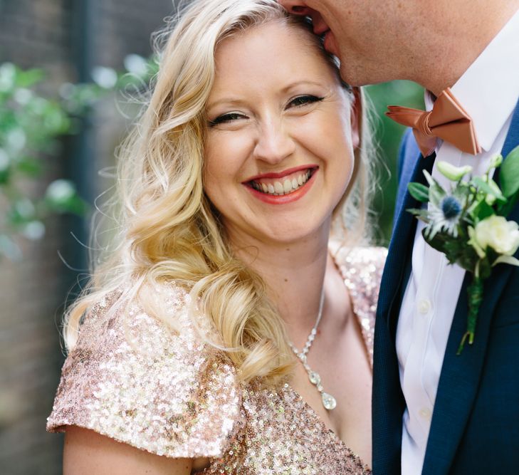 Bride in Gold Sequin Gibson Bespoke Wedding Dress & Groom in Marks and Spencer Suit