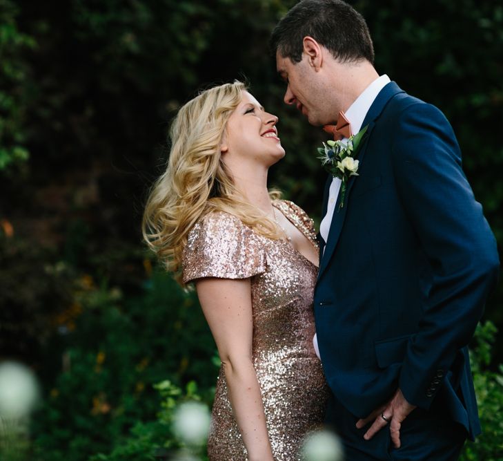 Bride in Gold Sequin Gibson Bespoke Wedding Dress & Groom in Marks and Spencer Suit