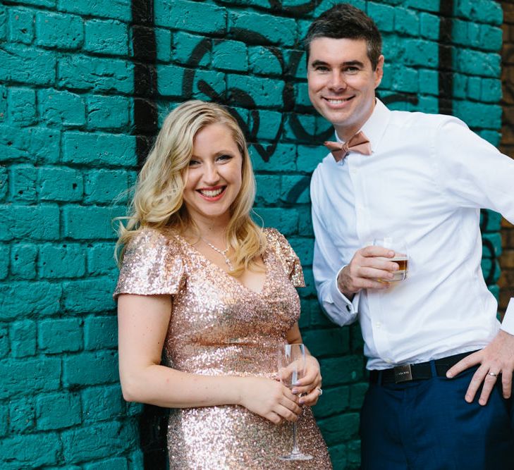 Bride in Gold Sequin Gibson Bespoke Wedding Dress & Groom in Marks and Spencer Suit