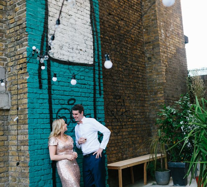 Bride in Gold Sequin Gibson Bespoke Wedding Dress & Groom in Marks and Spencer Suit