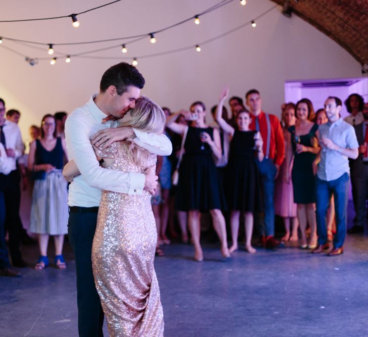 Bride in Gold Sequin Gibson Bespoke Wedding Dress & Groom in Marks and Spencer Suit