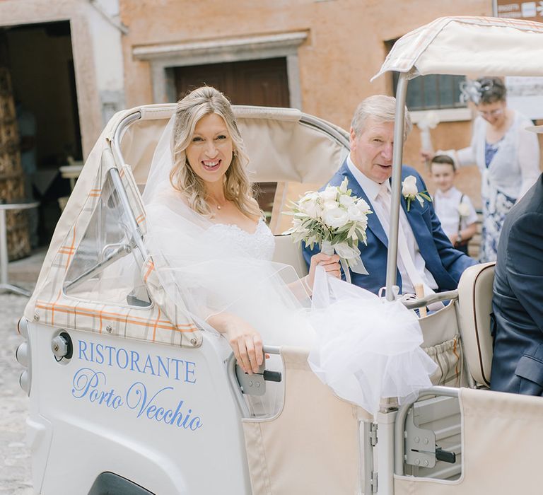 Bridal Entrance on a Tuc Tuc | Elegant Family Destination Wedding at Malcesine in Italy, Planned by Lake Garda Weddings | Georgina Harrison Photography