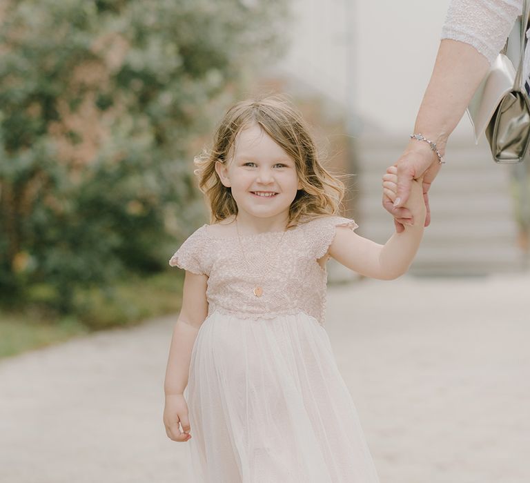 Flower Girl in Monsoon Dress | Elegant Family Destination Wedding at Malcesine in Italy, Planned by Lake Garda Weddings | Georgina Harrison Photography