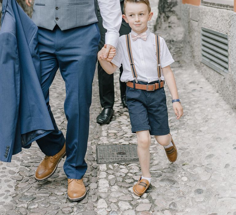 Page Boy in Next, Shorts, Braces & Bow Tie | Elegant Family Destination Wedding at Malcesine in Italy, Planned by Lake Garda Weddings | Georgina Harrison Photography