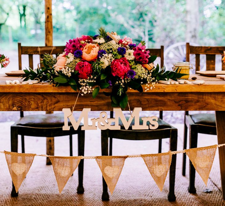 Chair Backs & Floral Arrangement Decor | Woodland Wedding | Epic Love Story Photography