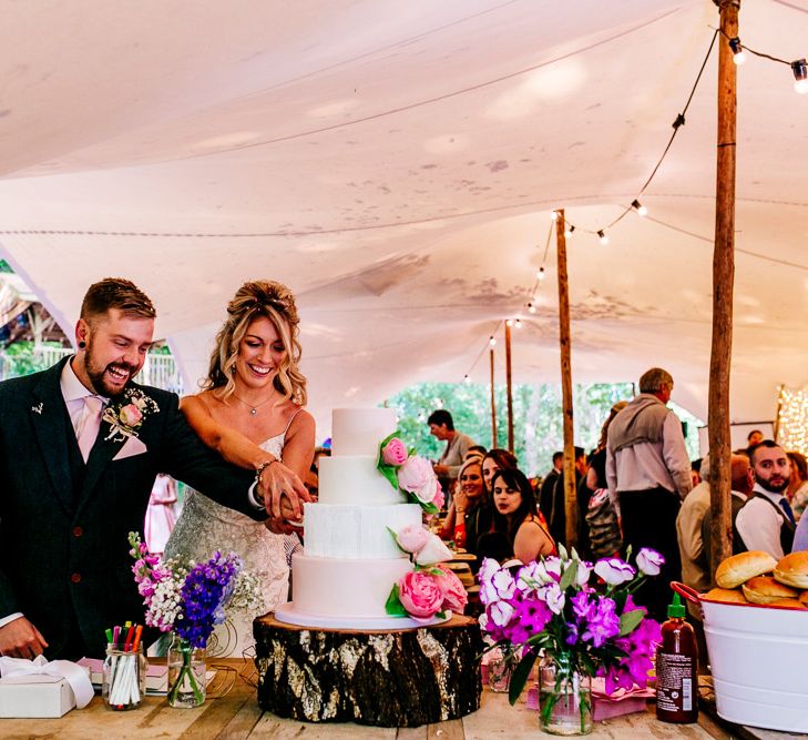 Cutting the Cake | Bride in Lace Anna Sorrano Gown | Groom in Tweed Vintage Suit Hire Suit | Epic Love Story Photography