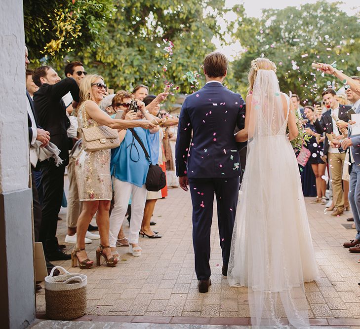 Confetti Exit | Bride in Flora Bridal Wedding Dress | Raquel Benito Photography