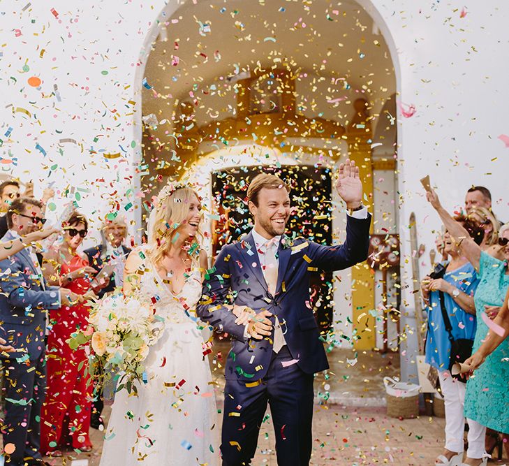 Confetti Exit | Bride in Flora Bridal Wedding Dress | Raquel Benito Photography