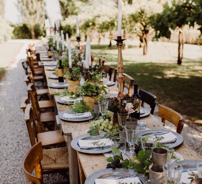 Rustic Wedding In Italy At Locanda Rosa Rosae With Intimate Candle Lit Dinner At Wooden Table With Fresh Fruit Decor