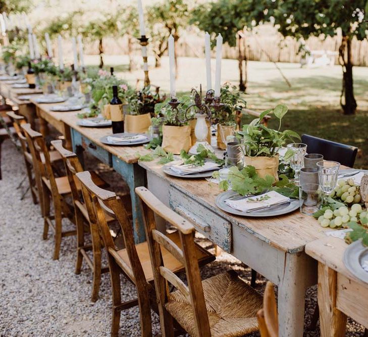 Rustic Wedding In Italy At Locanda Rosa Rosae With Intimate Candle Lit Dinner At Wooden Table With Fresh Fruit Decor