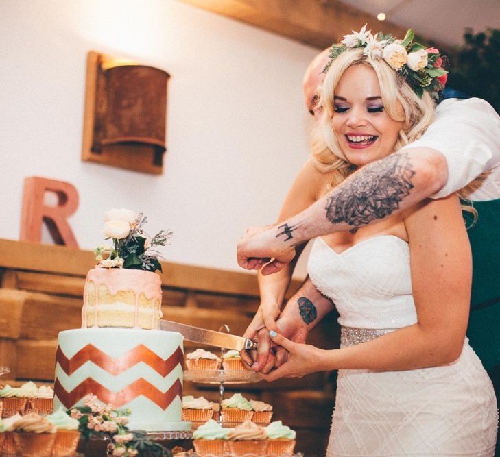 Bride & Groom Cutting The Cake