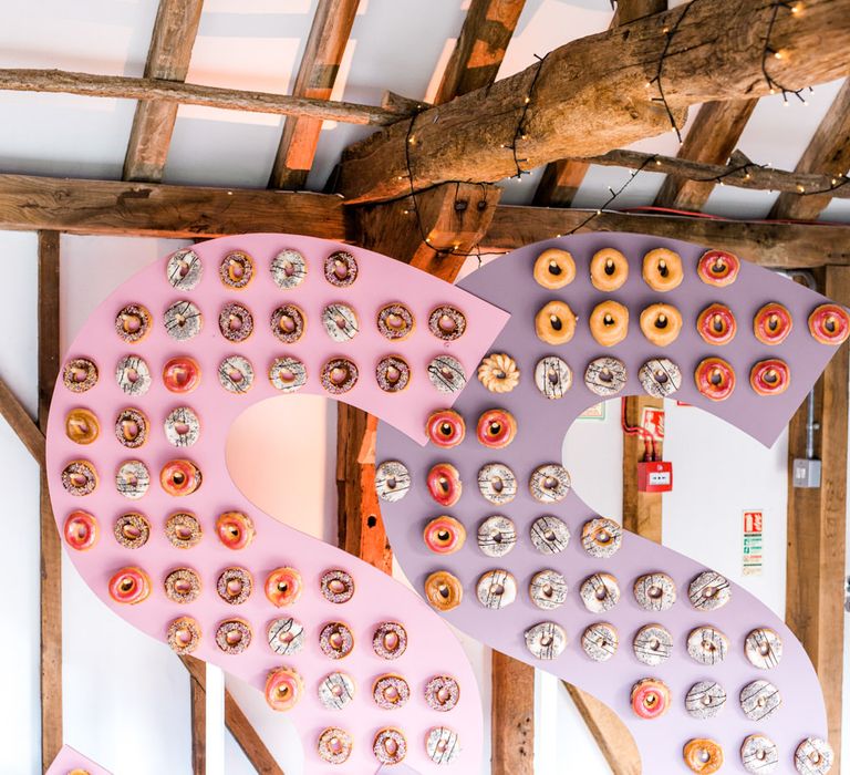 Krispy Kreme Doughnut Wall | Thames Chase Centre Boho Wedding | Gyan Gurung Photography